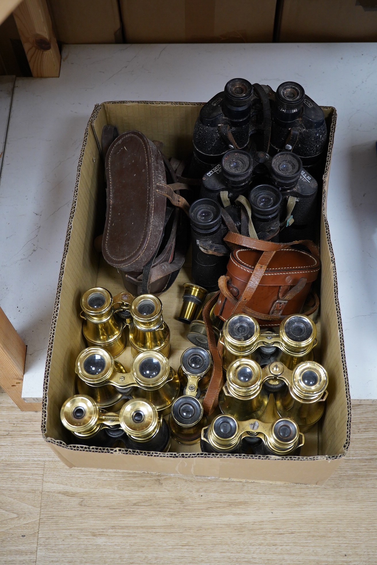 A collection of brass and military binoculars, largest 23cm high (12). Condition - variable